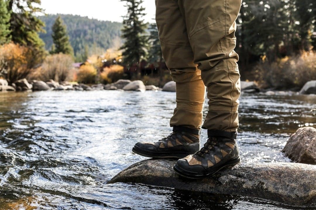 Fly fisherman casting in a Colorado mountain river