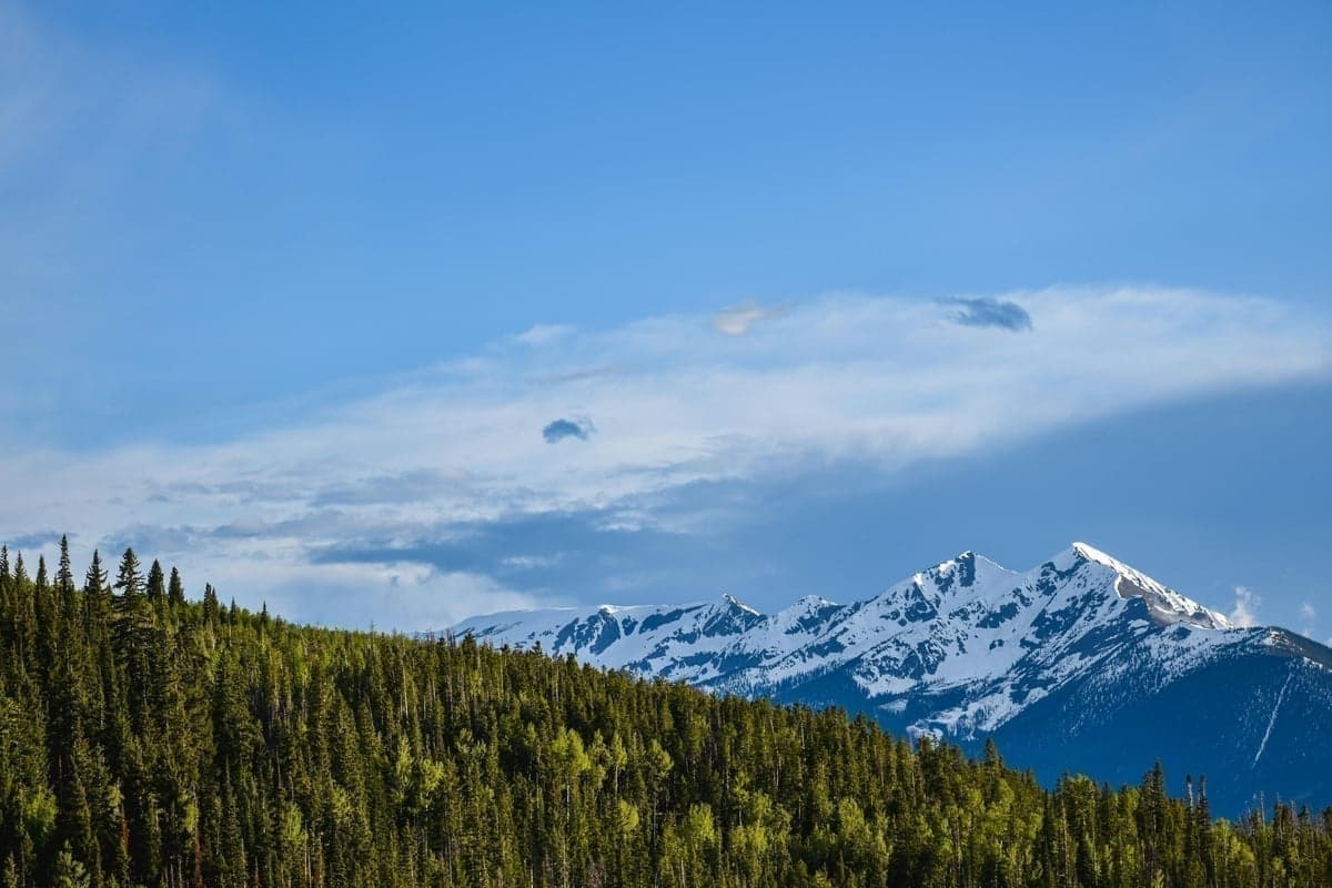 Snow-dusted Gore Range peaks rising above a Colorado mountain valley