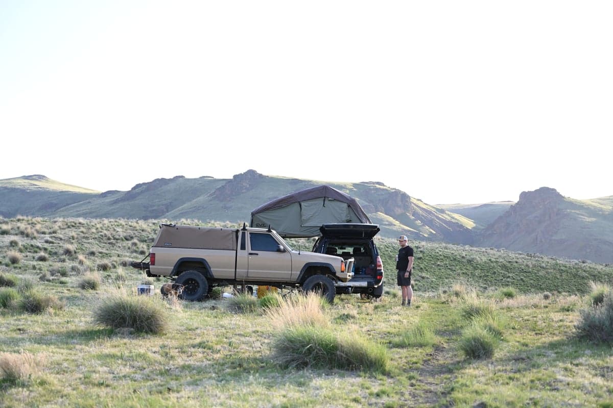 Truck camping setup somewhere in the West. Rooftop tent optional, flat ground required.