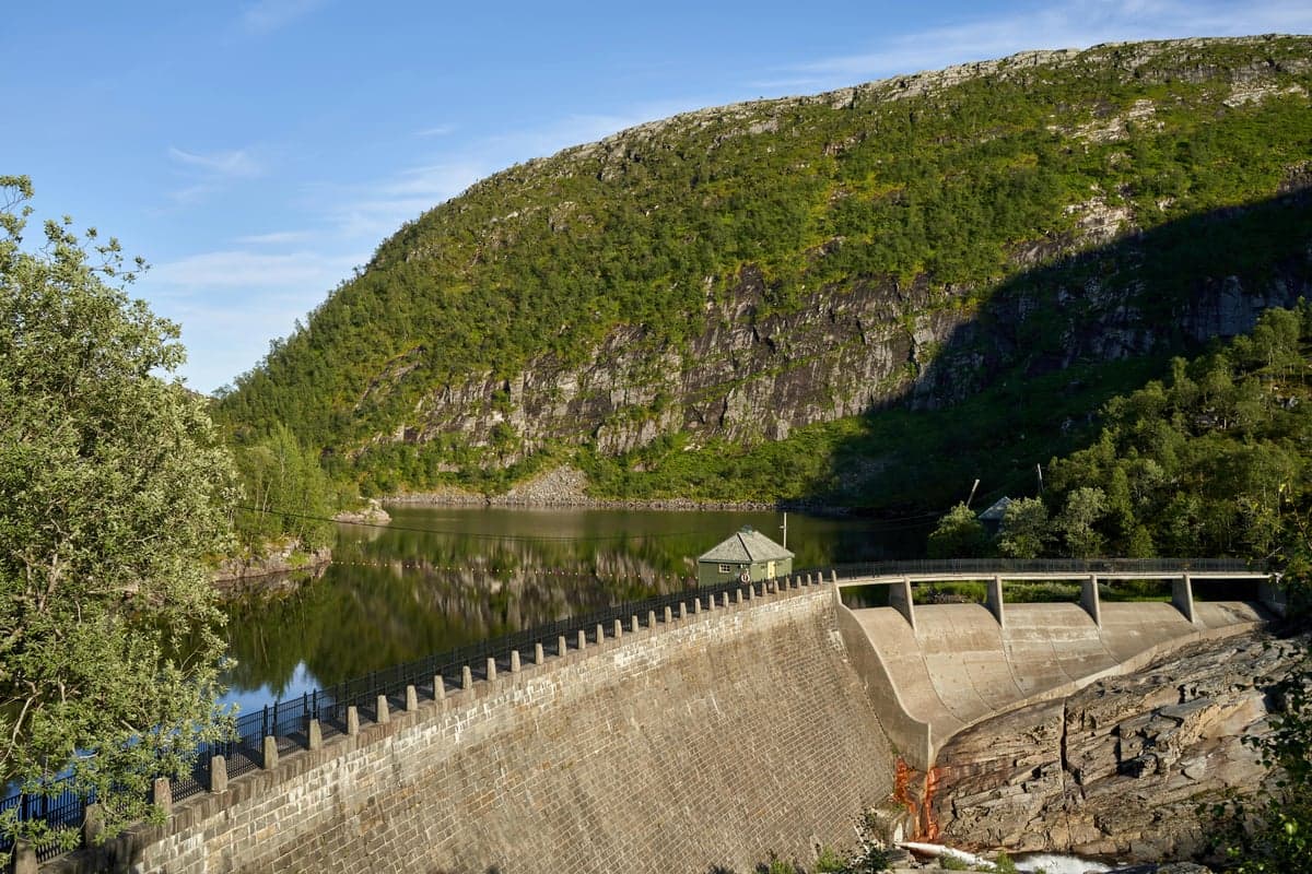 Mountain dam and reservoir, similar to Gathright Dam on the Jackson River, which creates Virginia's premier tailwater fishery