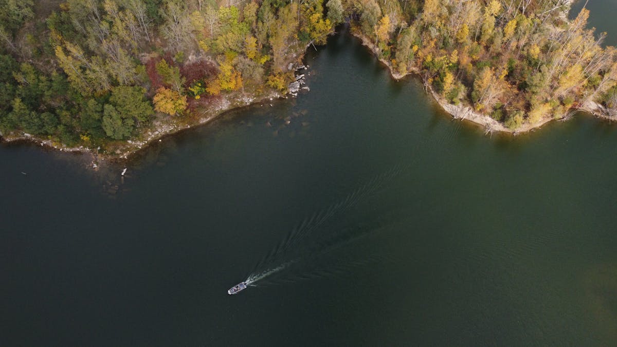 Aerial view of the Grand River in Grand Rapids, Michigan with vibrant fall foliage along the banks