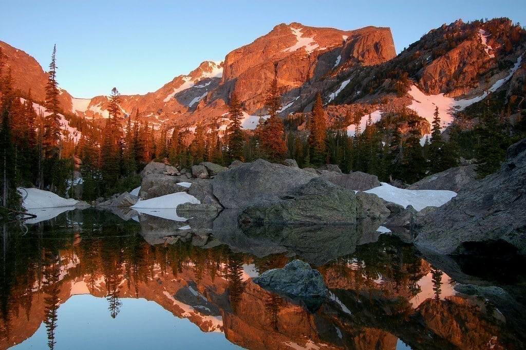 Mountain stream flowing through Rocky Mountain National Park with rocky terrain and alpine meadows